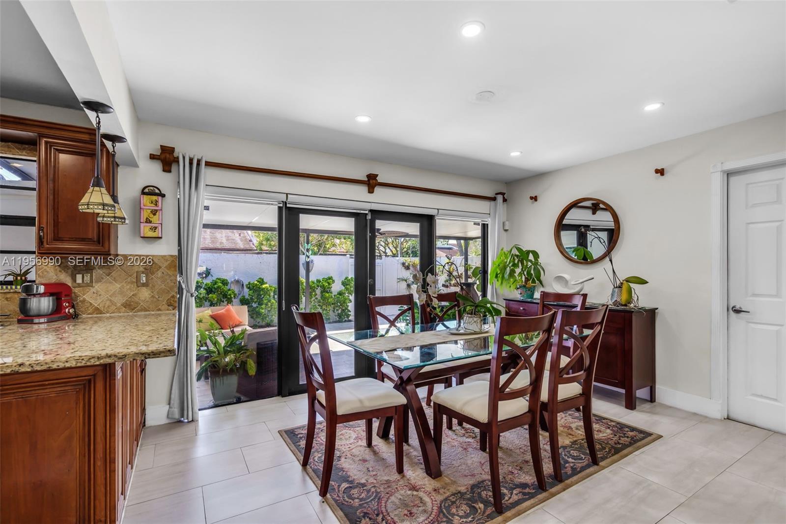 9466 Southwest 6th Lane Miami, FL 33174 - Photo 7 of 34 a view of a dining room with furniture window and outside view