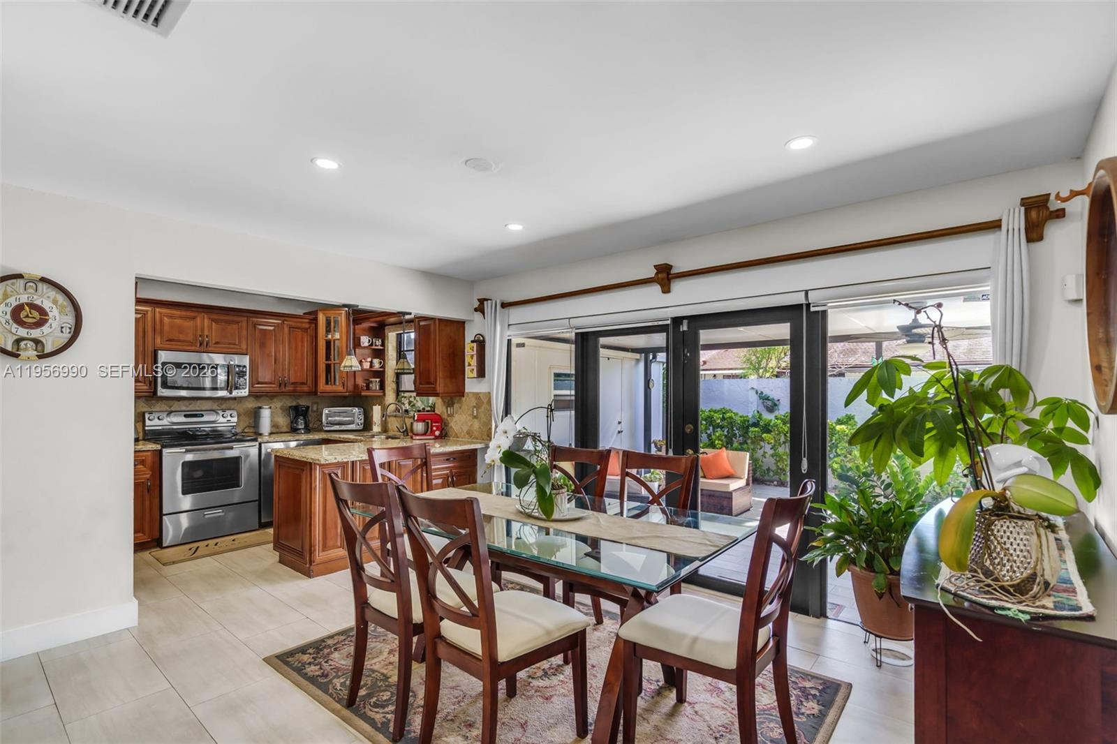 9466 Southwest 6th Lane Miami, FL 33174 - Photo 9 of 34 a view of a dining room with furniture window and outside view