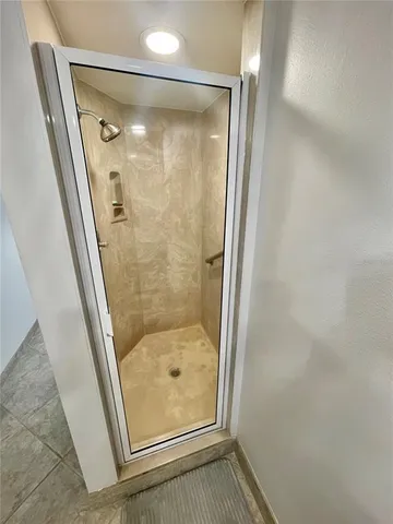 a spacious bedroom with a bed and a couch