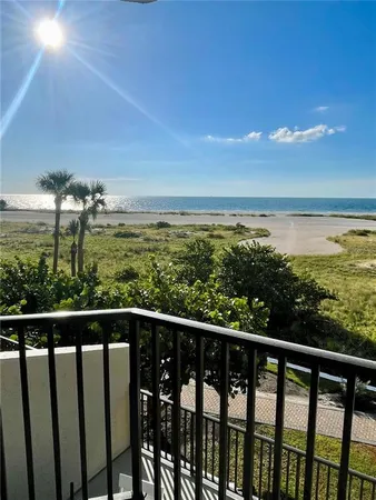 a view of a balcony with an ocean view