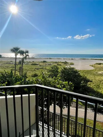 a view of a balcony with an ocean view