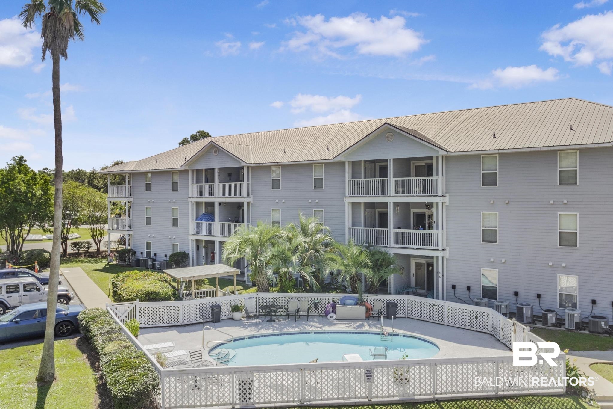 25957 Canal Road, Unit 306 Orange Beach, AL 36561 - Photo 23 of 28 View of swimming pool with a patio