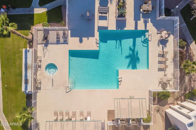 a view of a swimming pool with a patio