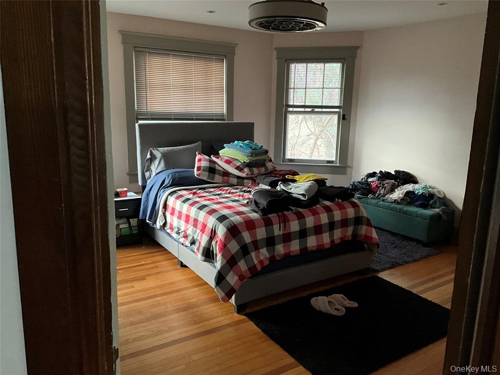 265 Spring Street Monroe, NY 10950 - Photo 13 of 20 a bed sitting in a bedroom next to a window