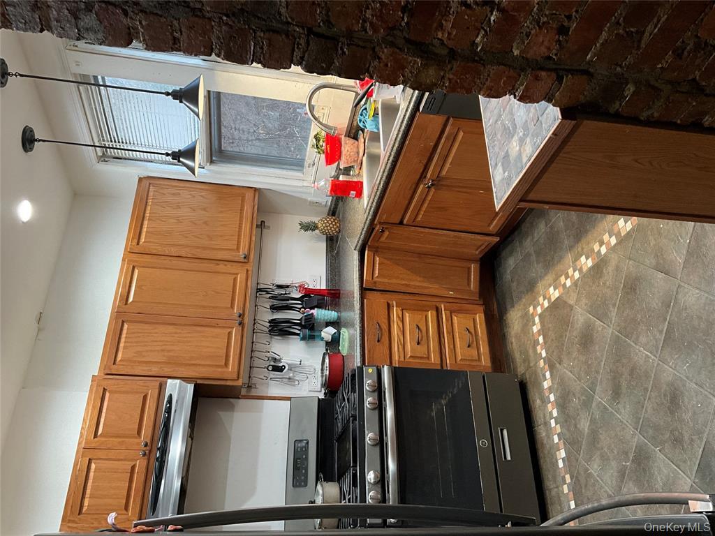 265 Spring Street Monroe, NY 10950 - Photo 2 of 20 a kitchen with stainless steel appliances granite countertop a stove a sink and a refrigerator