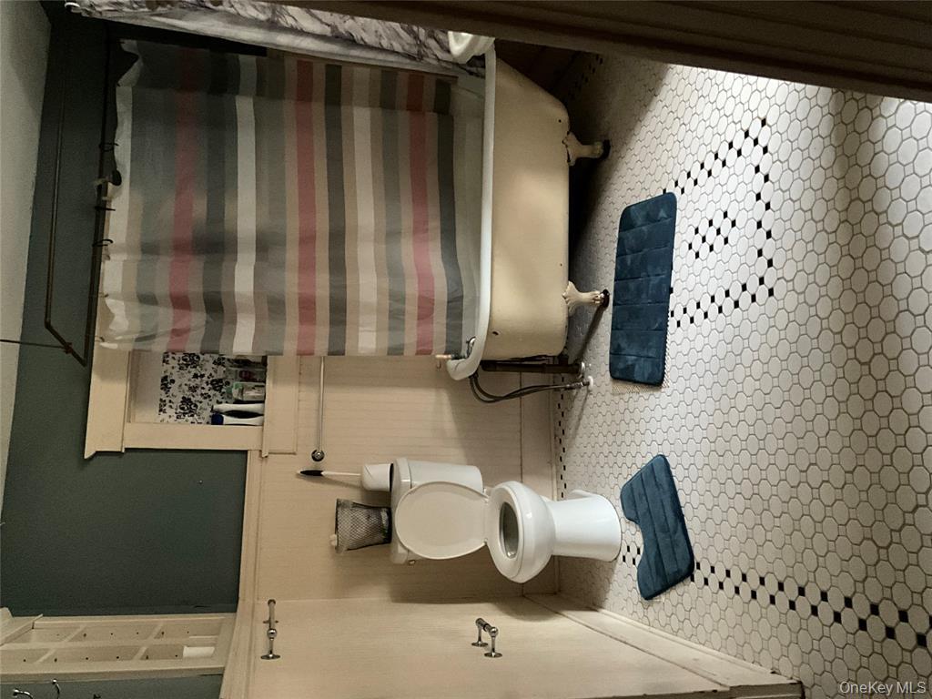 265 Spring Street Monroe, NY 10950 - Photo 9 of 20 a bathroom with a sink toilet and shower