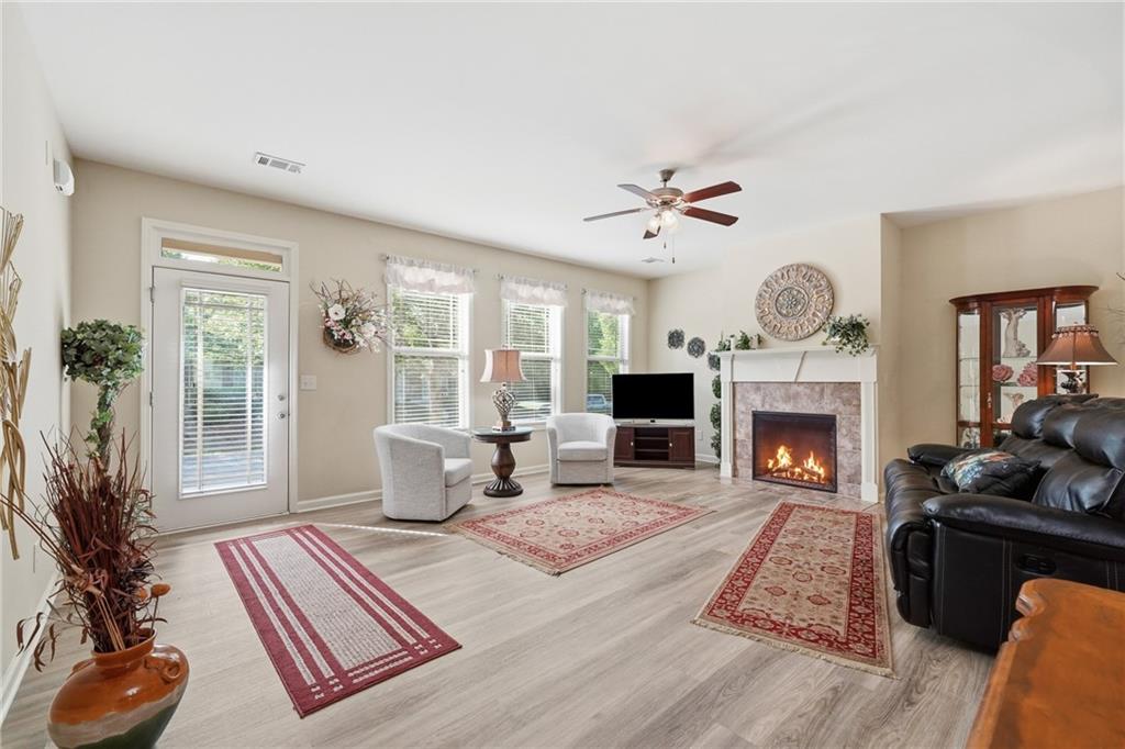 608 Myers Gate Road Ball Ground, GA 30107 - Photo 11 of 31 a living room with furniture and a fireplace