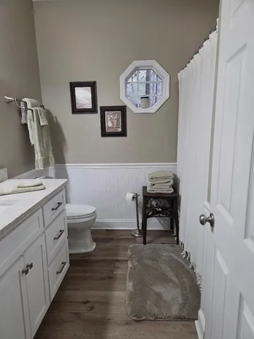 a view of a livingroom with workspace and a couch