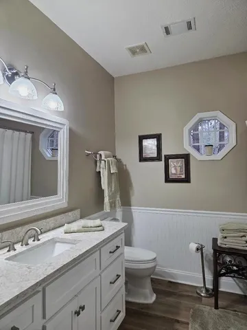 a bedroom with furniture and window