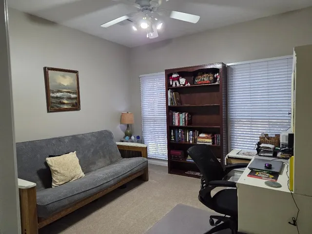 a bedroom with a bed and a table in it