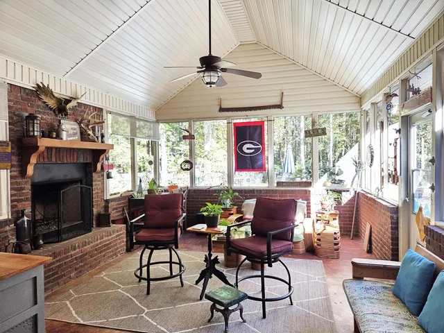 a view of a chair and table in the garden