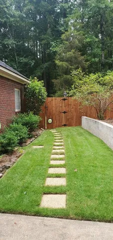 a view of a house with snow on the road