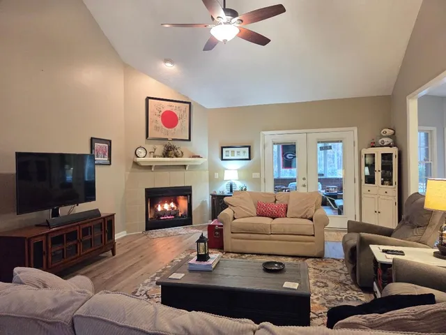 a kitchen with a table chairs and refrigerator