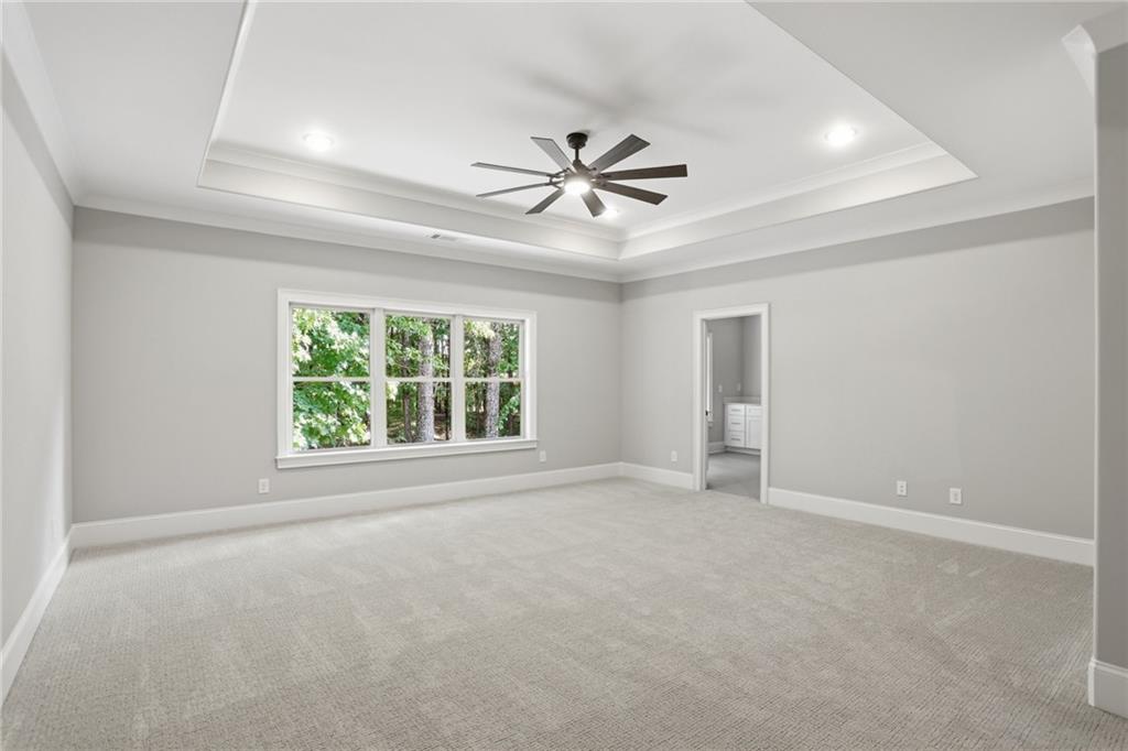 222 Trecastle Square, Unit 21 Canton, GA 30114 - Photo 26 of 33 an empty room with windows and fan