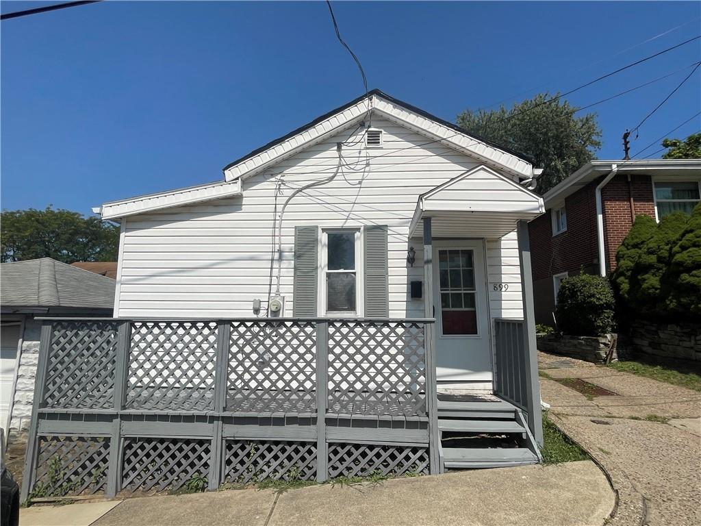 a front view of a house with a fence