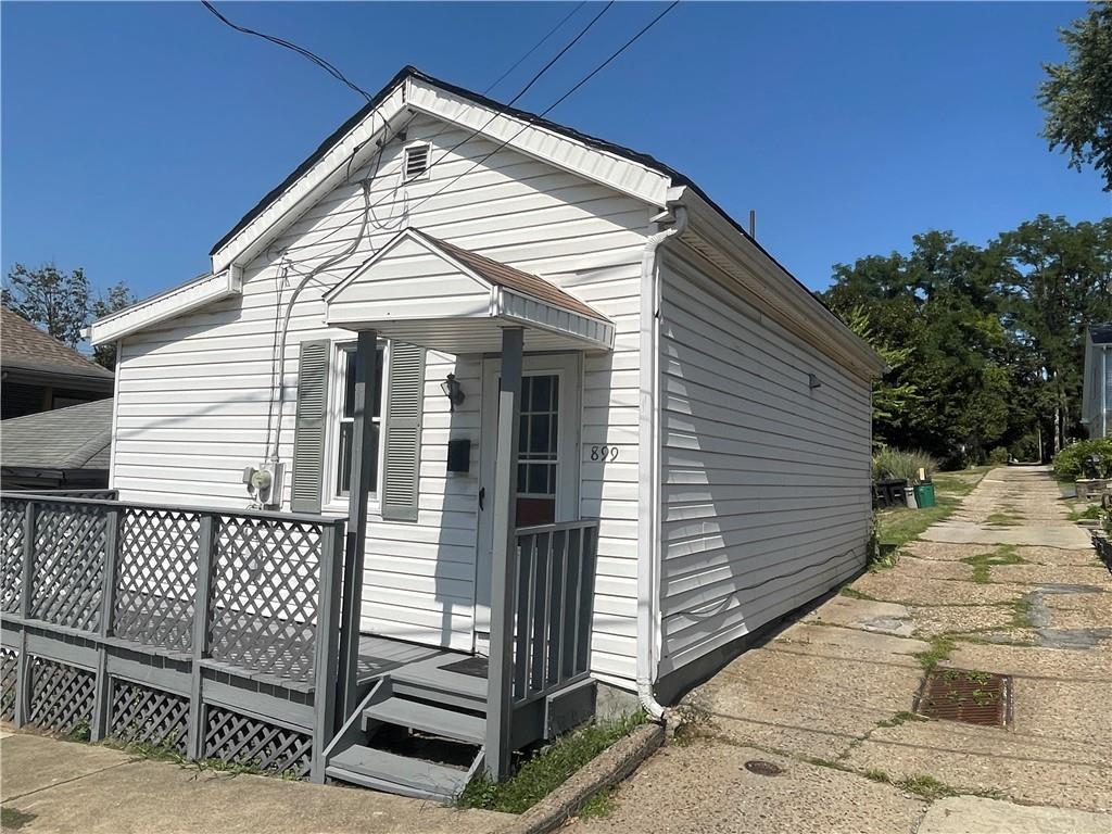 899 9th Street Ambridge, PA 15003 - Photo 16 of 18 a view of a house with wooden fence