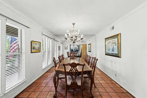 a kitchen with stainless steel appliances kitchen island granite countertop a sink and cabinets