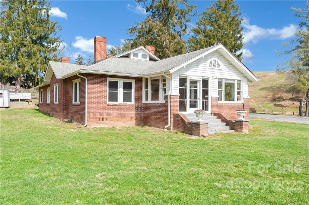 1715 Thickety Road Clyde, NC 28721 - Photo 1 of 25 a front view of a house with a yard