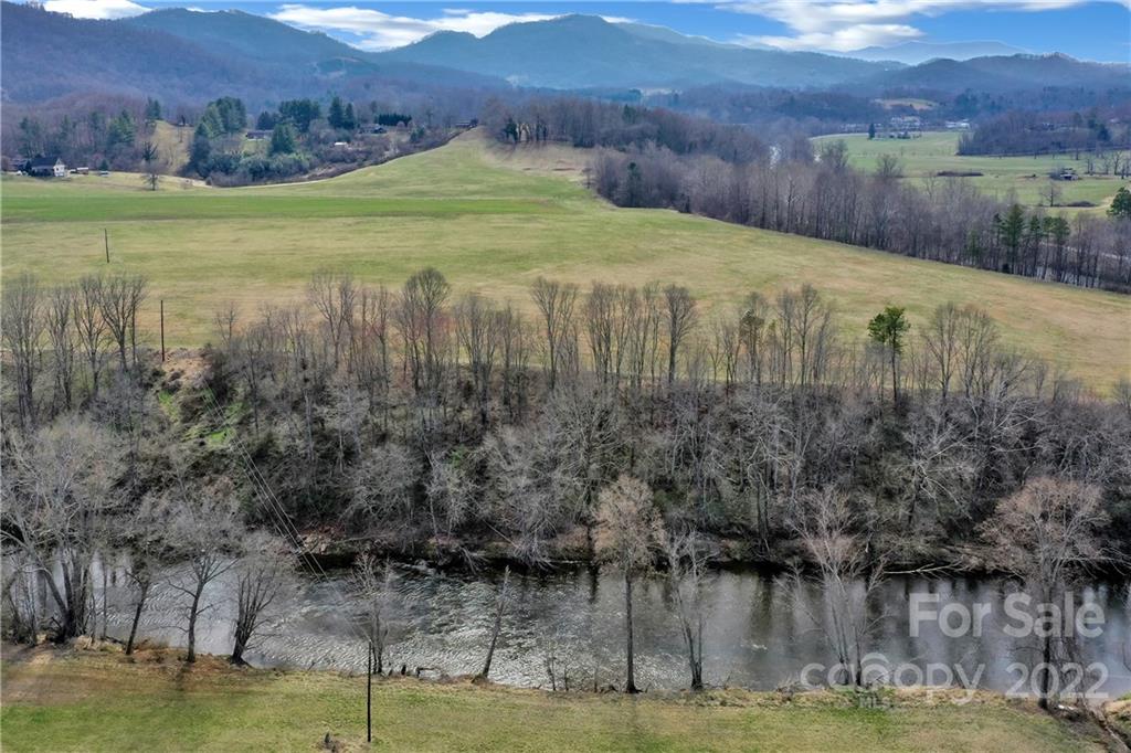 1715 Thickety Road Clyde, NC 28721 - Photo 25 of 25 a view of a lake with a mountain