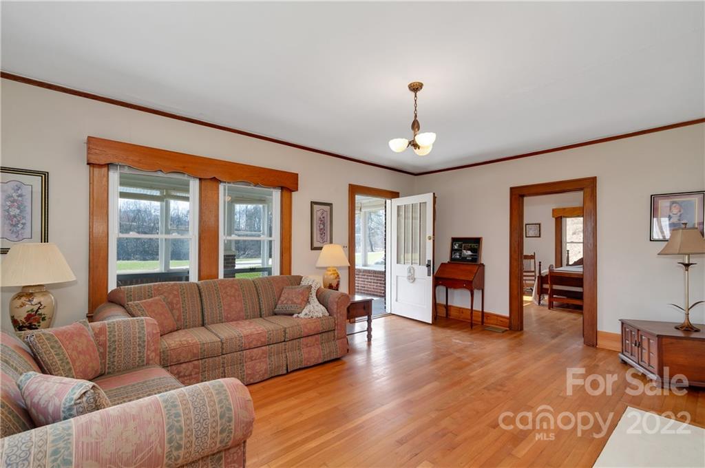 1715 Thickety Road Clyde, NC 28721 - Photo 6 of 25 a living room with furniture and wooden floor