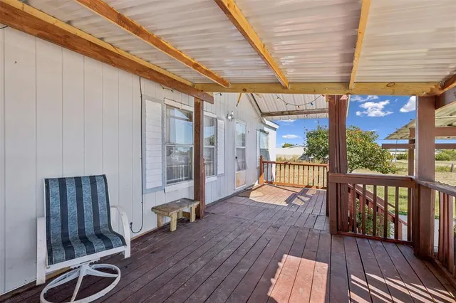 an outdoor view of patio with wooden floor