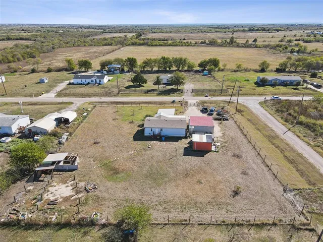 an aerial view of a house with a lake view