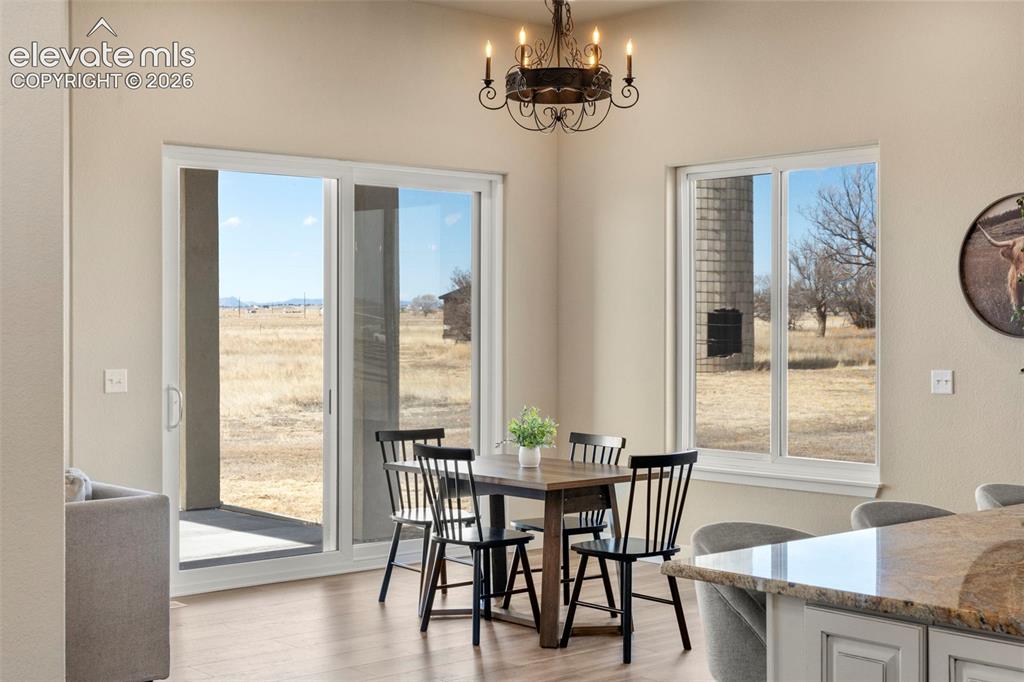2480 North Log Road Calhan, CO 80808 - Photo 10 of 50 Dining area offers incredible mountain and rustic rural views