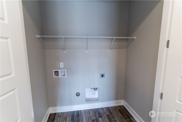 a view of storage and utility room with racks on the wall