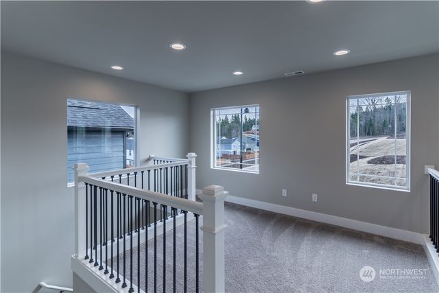 a view of staircase with railing and stairs