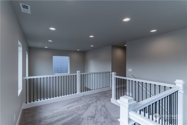 a view of hallway with windows