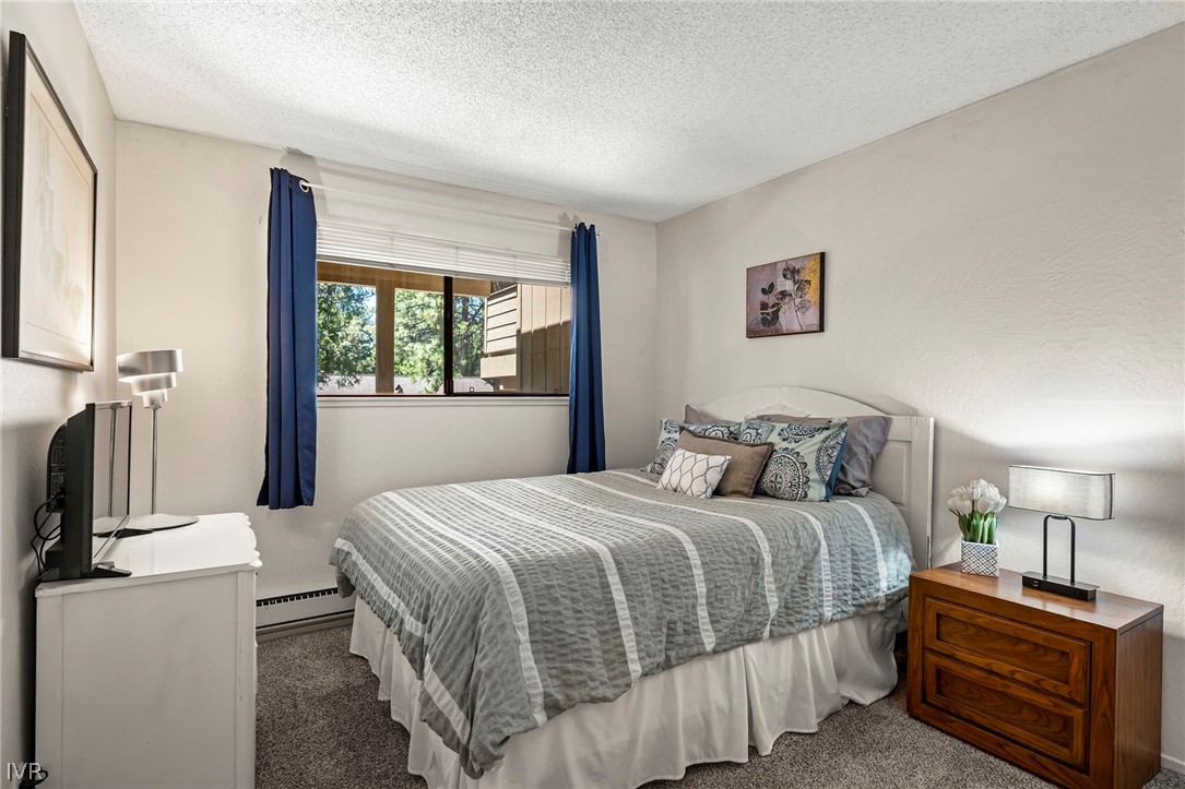 321 Ski Way, Unit 137 Incline Village, NV 89451 - Photo 17 of 21 a bedroom with a bed and a window