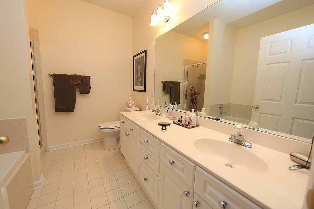 3111 Hemlock Forest Circle, Unit 104 Raleigh, NC 27612 - Photo 13 of 19 Has 2 sinks! There are two super closets as you walk from bedroom to this large master bath. Master Bath/Spa