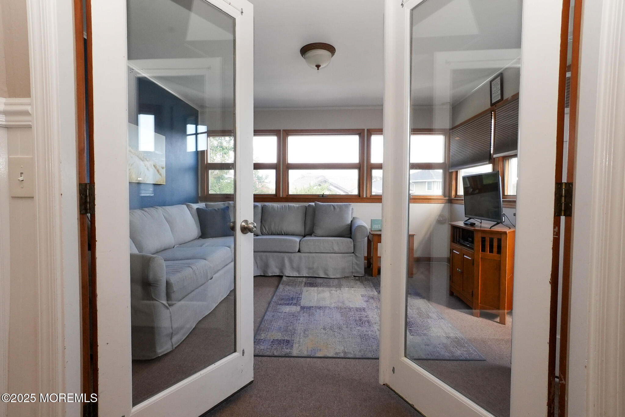 201 Forman Avenue Point Pleasant Beach, NJ 08742 - Photo 25 of 54 a living room with furniture and a floor to ceiling window