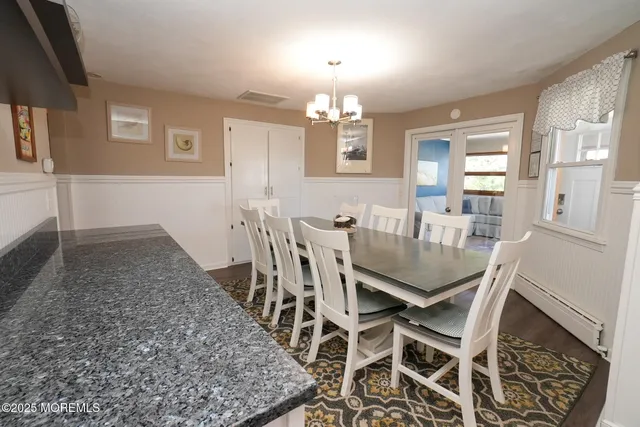 a kitchen with stainless steel appliances a stove sink microwave and cabinets