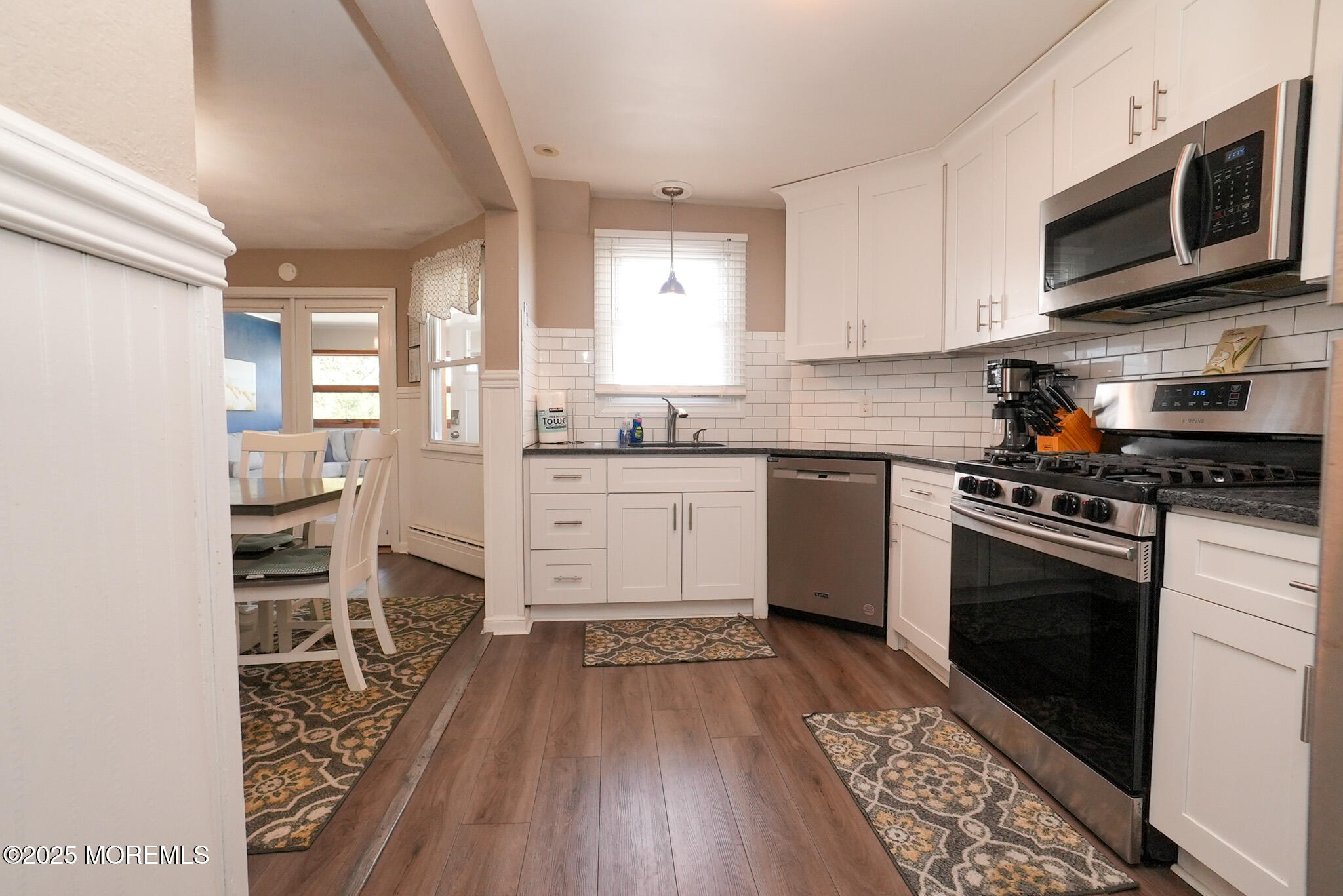 201 Forman Avenue Point Pleasant Beach, NJ 08742 - Photo 32 of 54 a kitchen with stainless steel appliances a stove sink microwave and cabinets