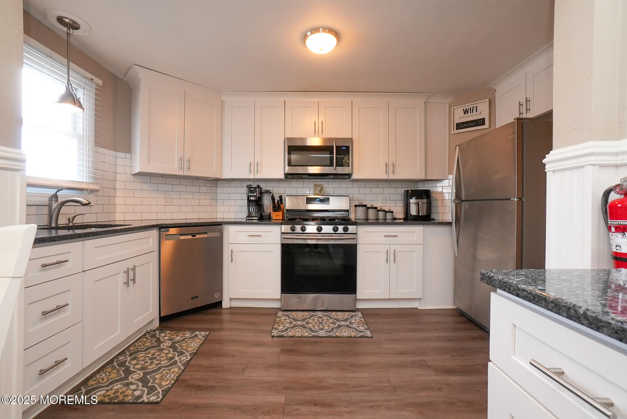 201 Forman Avenue Point Pleasant Beach, NJ 08742 - Photo 33 of 54 a kitchen with granite countertop a refrigerator stove top oven and sink
