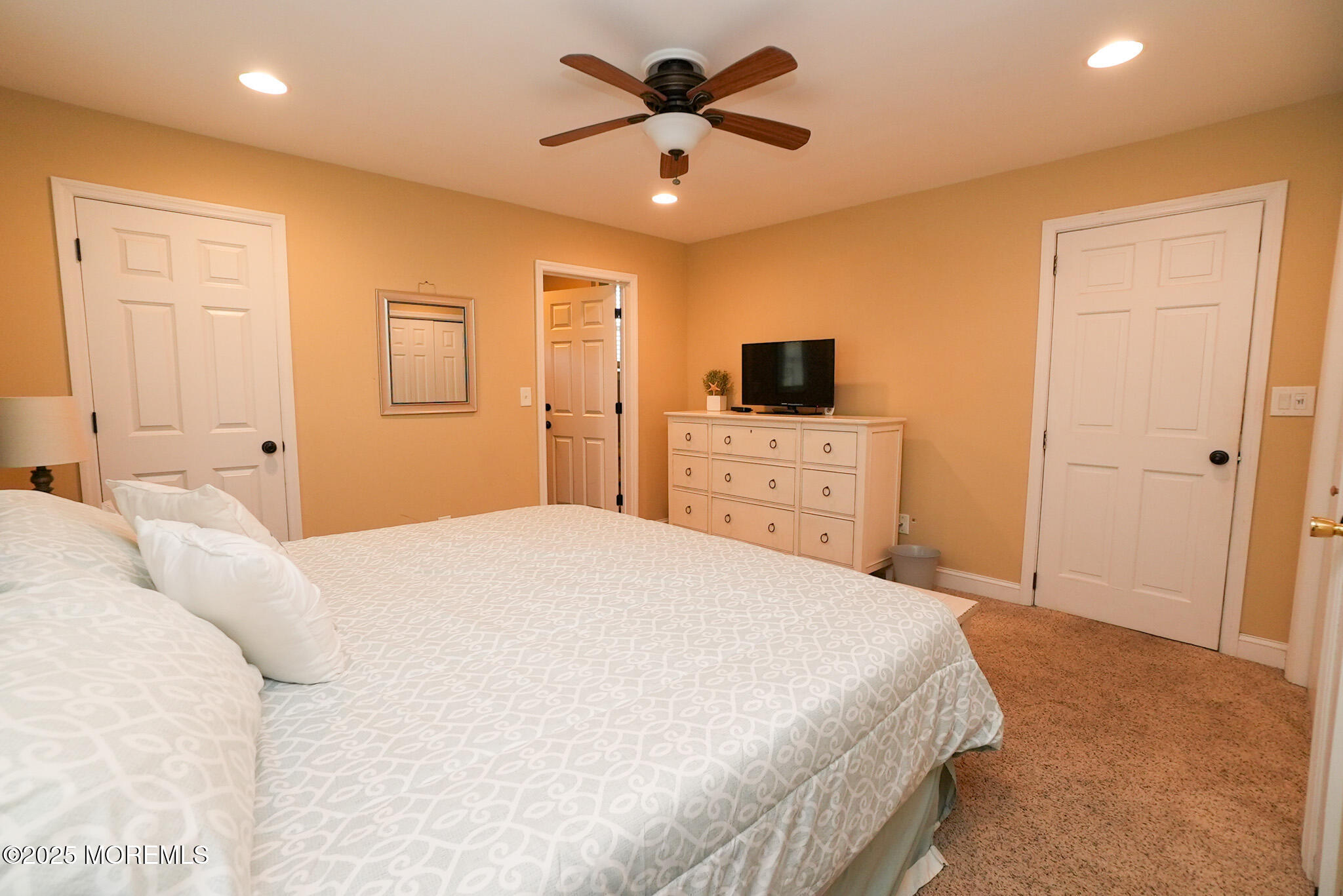 201 Forman Avenue Point Pleasant Beach, NJ 08742 - Photo 37 of 54 a bedroom with a bed and a flat screen tv