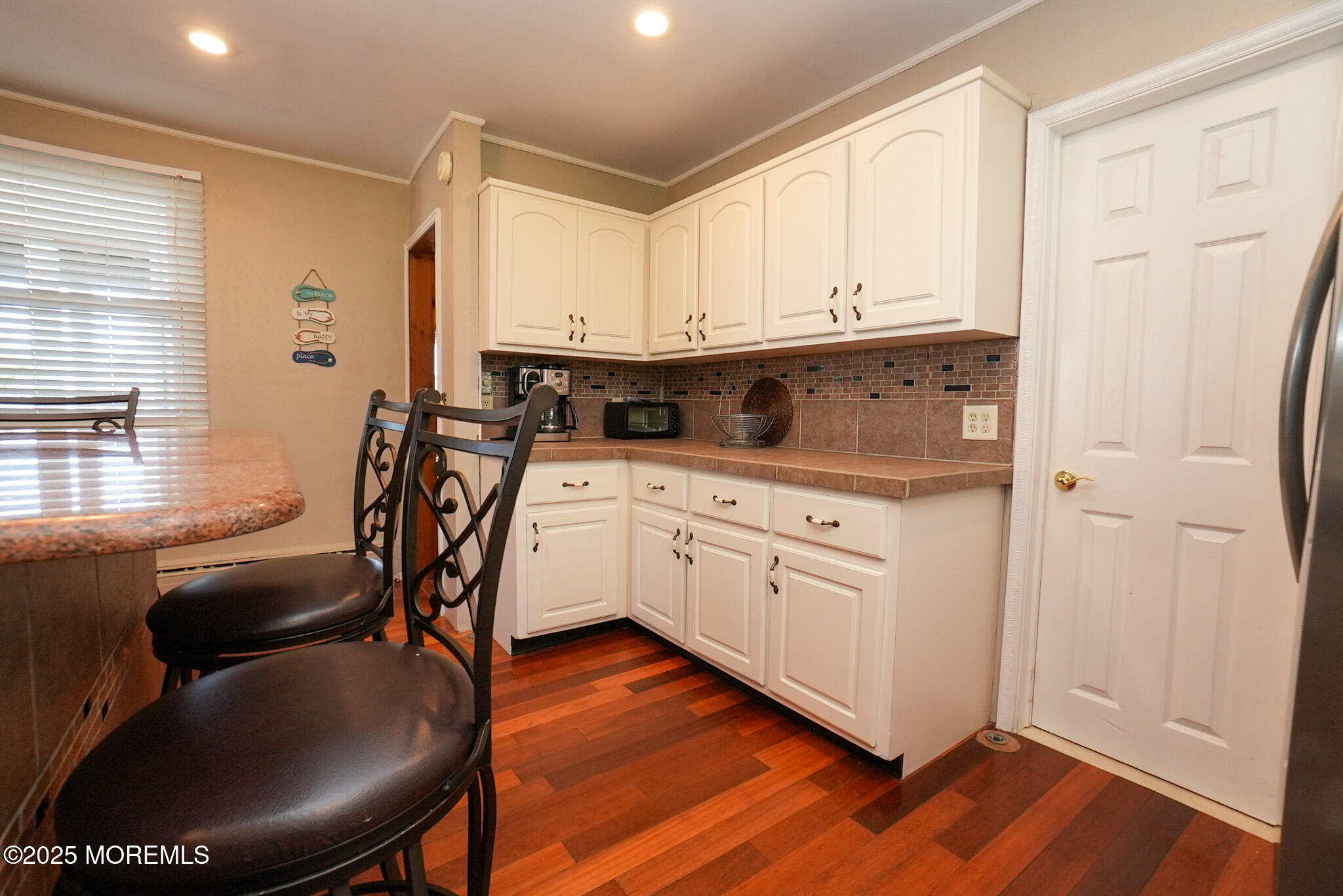 201 Forman Avenue Point Pleasant Beach, NJ 08742 - Photo 42 of 54 a kitchen with stainless steel appliances granite countertop a white cabinets and a refrigerator
