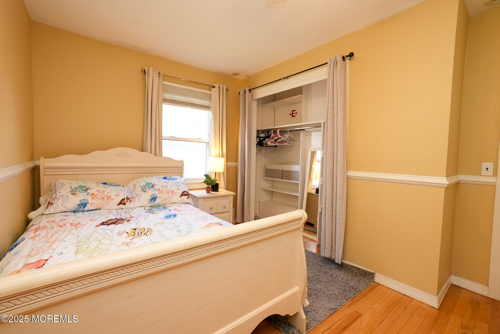 201 Forman Avenue Point Pleasant Beach, NJ 08742 - Photo 47 of 54 a bedroom with a bed and wooden floor