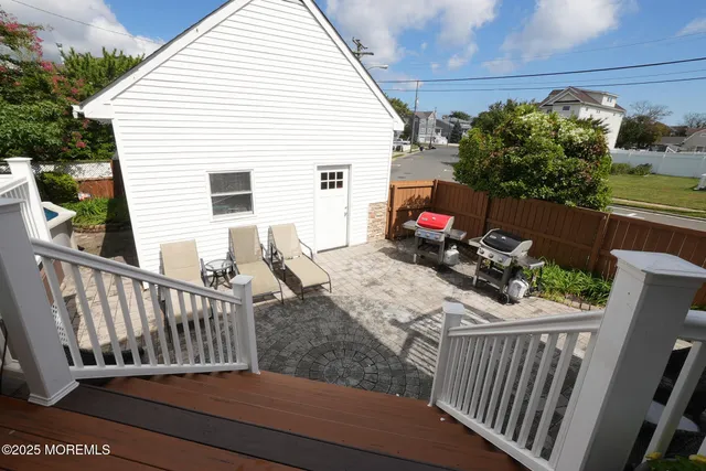 a view of a dinning table and chairs in patio