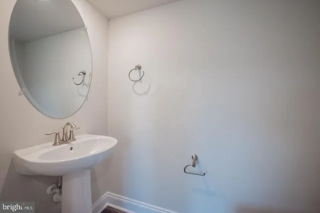 a bathroom with a sink and mirror