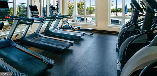 a view of swimming pool with a table and chairs