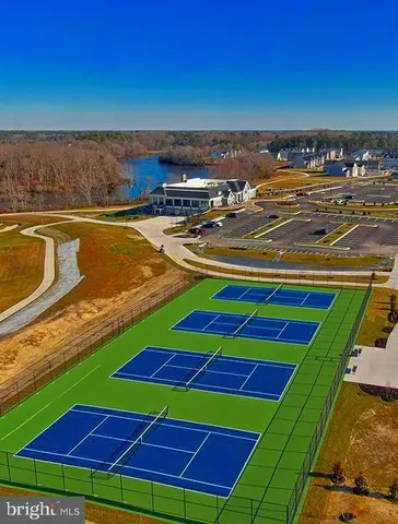 a swimming pool view with a seating space