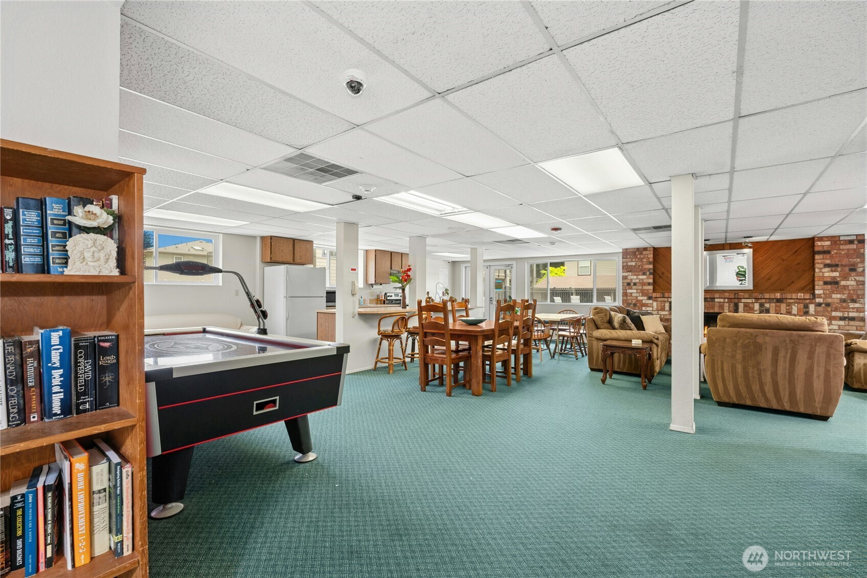 9523 Northeast 180th Street, Unit A102 Bothell, WA 98011 - Photo 27 of 29 a room with furniture and gym equipment