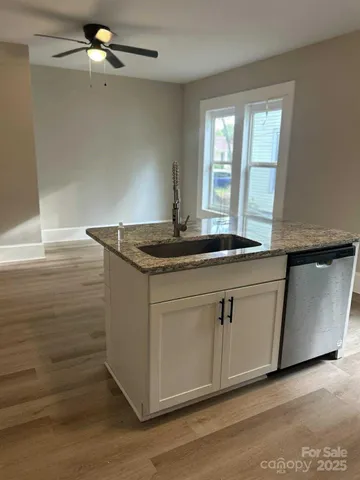 a kitchen with a sink and cabinets