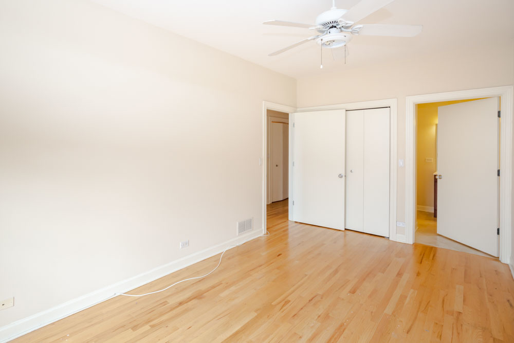 3349 North Clark Street, Unit 2SW Chicago, IL 60657 - Photo 11 of 13 a view of an empty room with wooden floor
