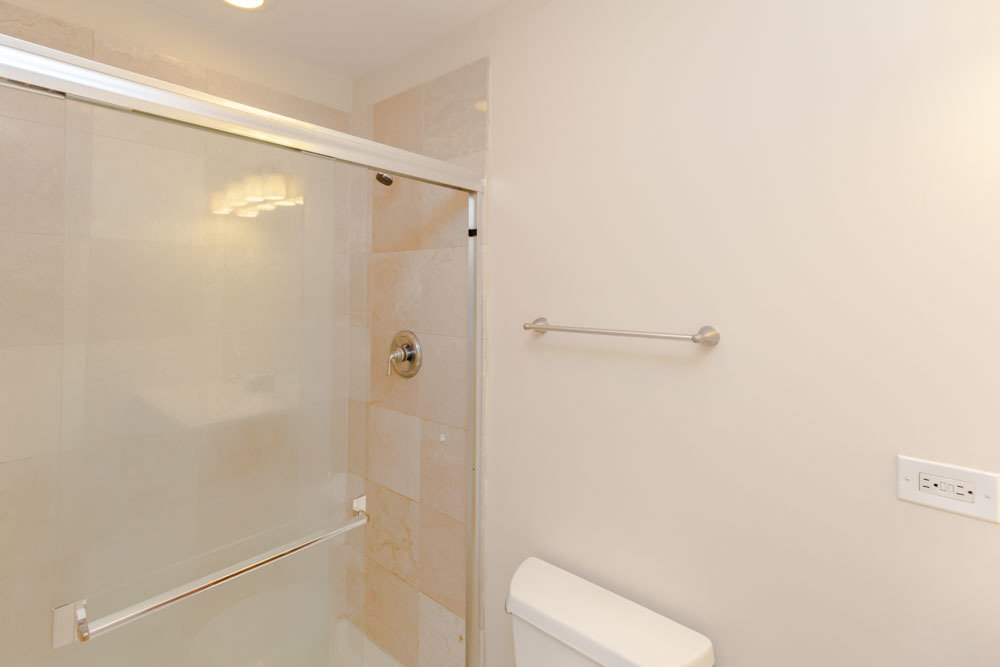 3349 North Clark Street, Unit 2SW Chicago, IL 60657 - Photo 13 of 13 a bathroom with a shower and toilet