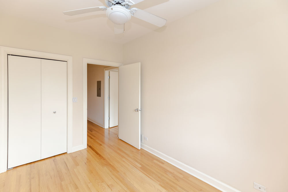 3349 North Clark Street, Unit 2SW Chicago, IL 60657 - Photo 8 of 13 a view of an empty room with wooden floor