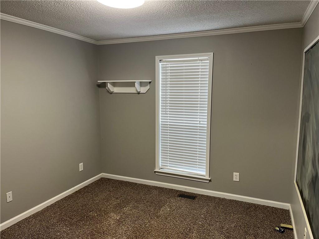 111 Green Point Way Carrollton, GA 30117 - Photo 20 of 29 an empty room with a window