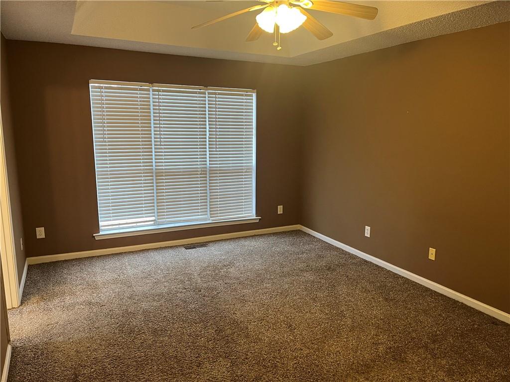 111 Green Point Way Carrollton, GA 30117 - Photo 6 of 29 an empty room with a empty space and a window